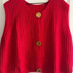 Red sweater vest with gold buttons